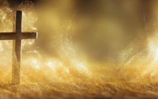 A gold cross standing in a glowing golden mist, symbolizing faith, spirituality, and the divine presence, perfect for Easter reflections.